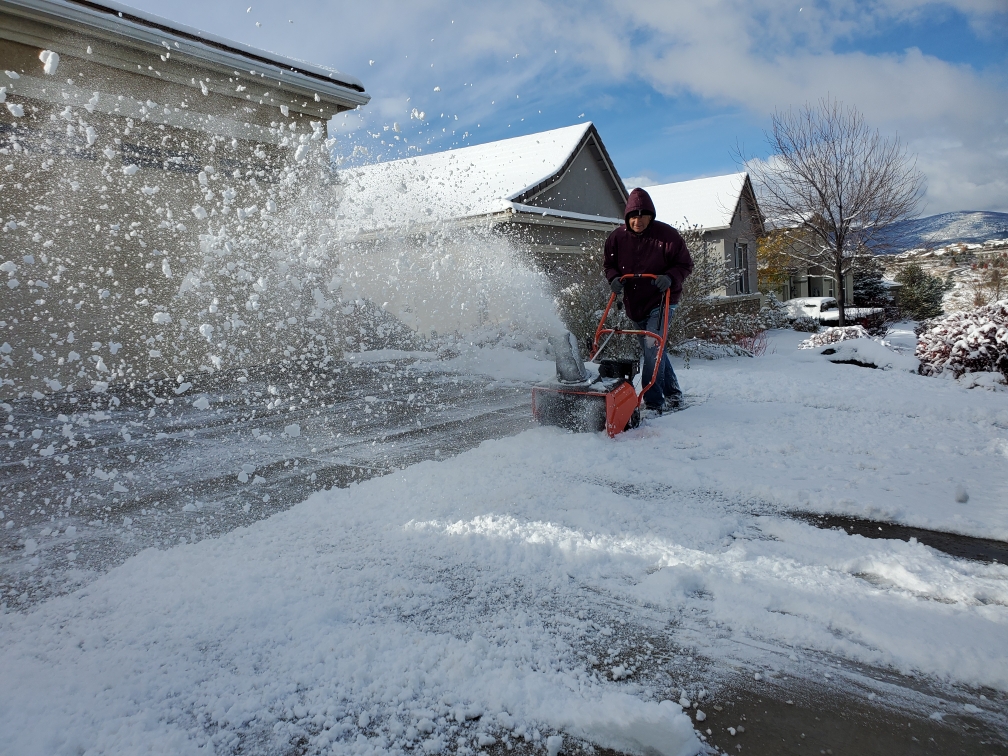 corys lawn service doing snow removal
